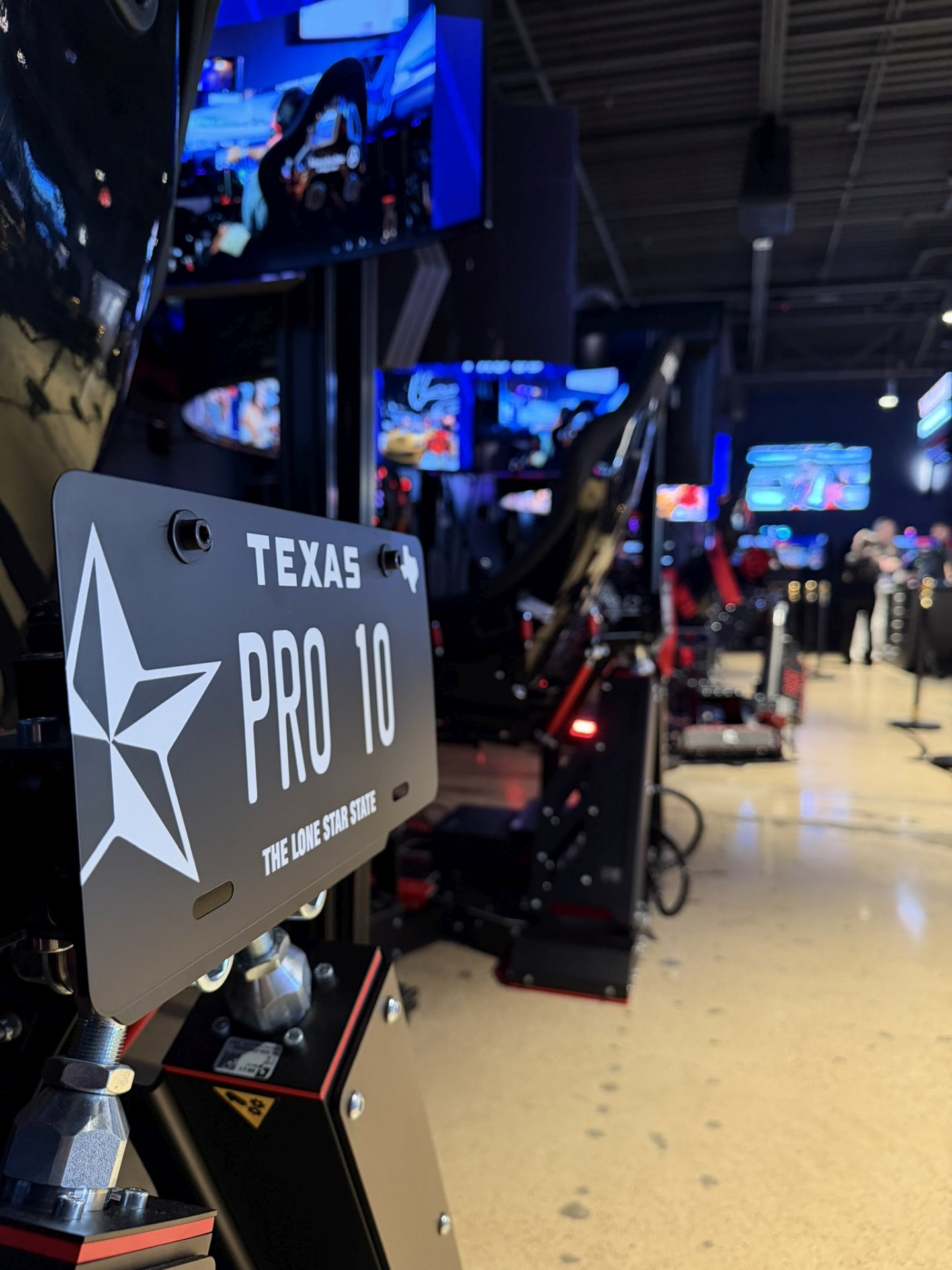 Row of Pro stations at Velocity Dallas, Sparco seats on Qubic System motion platforms