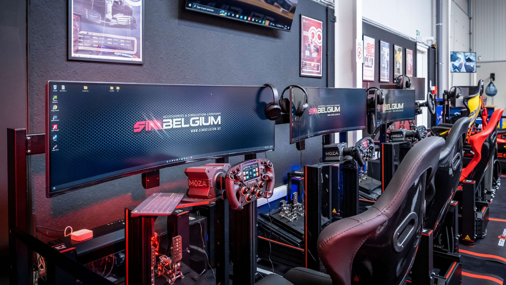 Racing simulator stations with ultrawide displays at the SimBelgium center in Merchtem